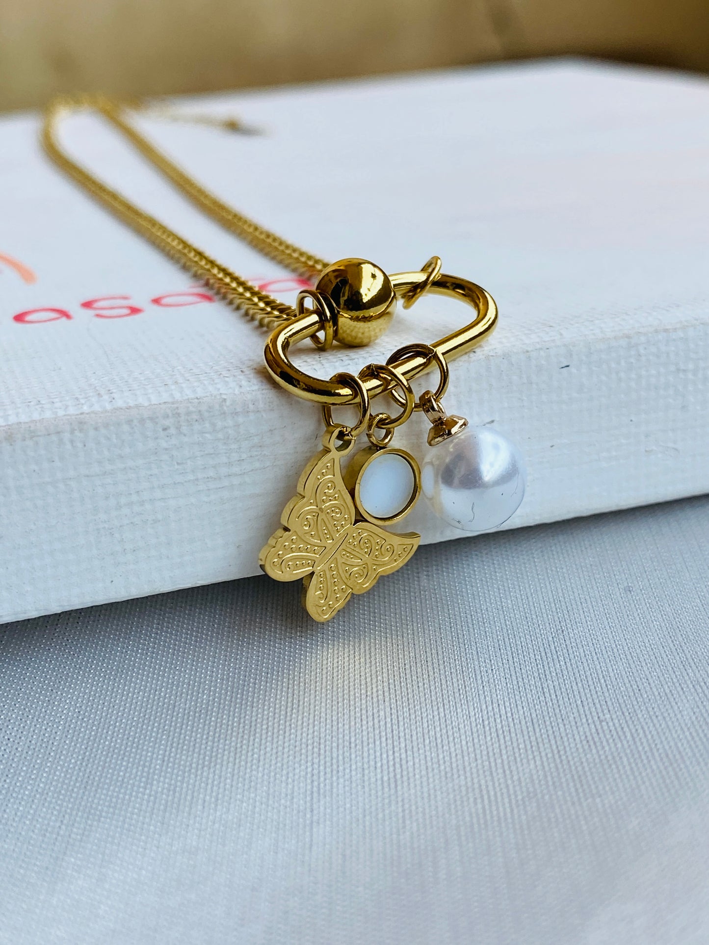 The Butterfly With The White Pearl Necklace